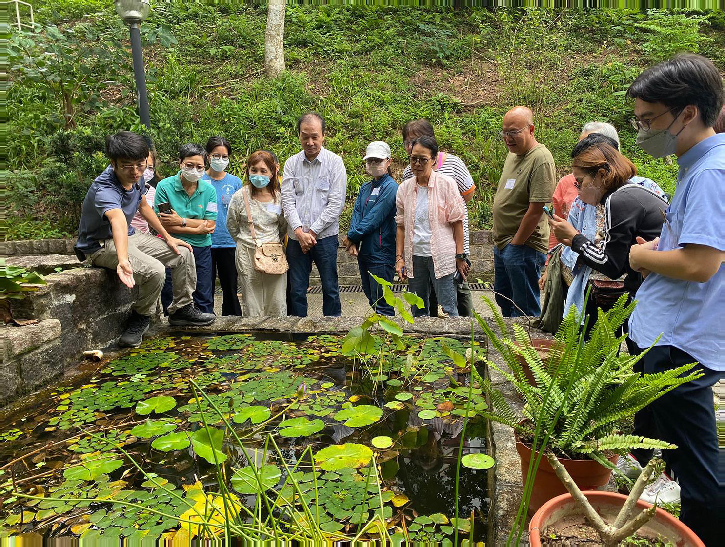 Corporate team touring Green Skies’ sustainable aquaponics farm initiative